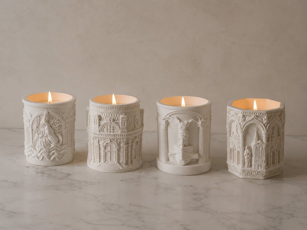 Set of 4 handmade gypsum candle holders with architectural relief soy candles burning marble background | MOSVAM
